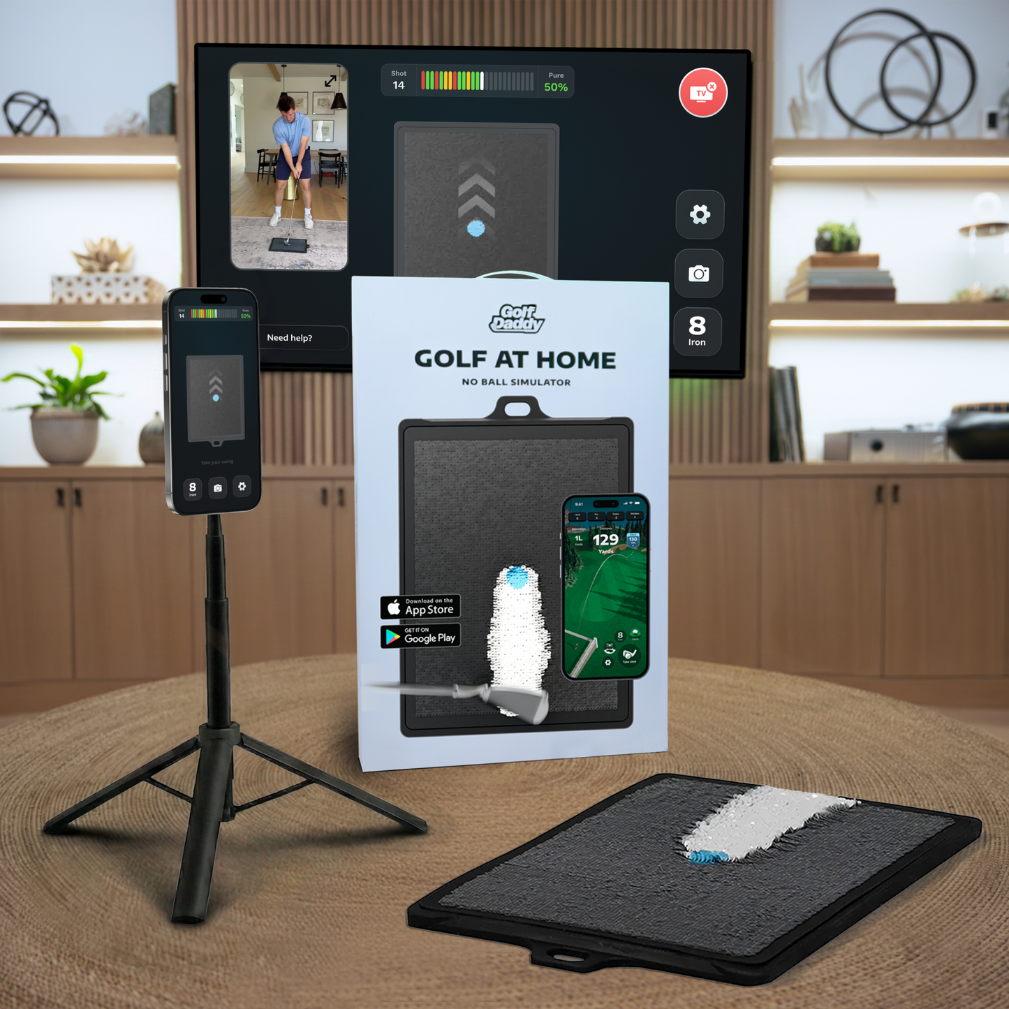 Golf at Home simulator setup with screen, stand, and packaging in a room